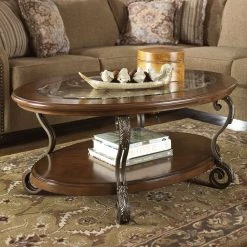 Ashley Nestor Medium Brown Oval Cocktail Table Living Room